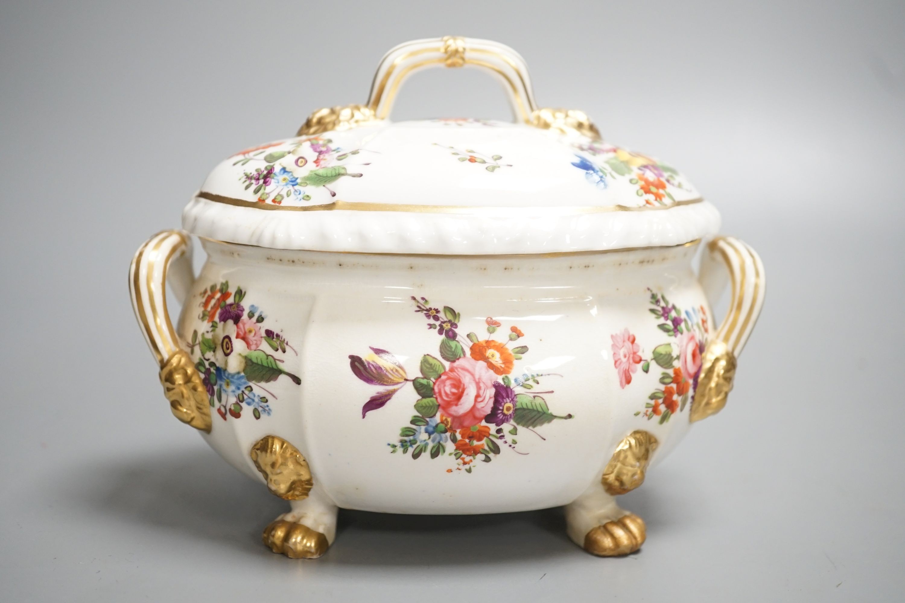 A Derby tureen and cover, early 19th century, on four feet with lion head masks painted with flowers, red mark, overall height 13.5cm
